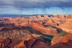 Sunrise at Dead Horse Point State Park overlooking the Colorado River and Canyonlands National Park.