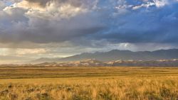 Storm over prairie and Great Sand Dunes National Park
