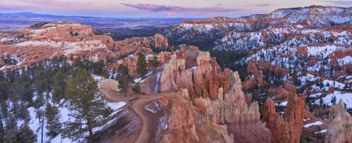 Bryce Canyon National Park Utah covered in snow at twilight.